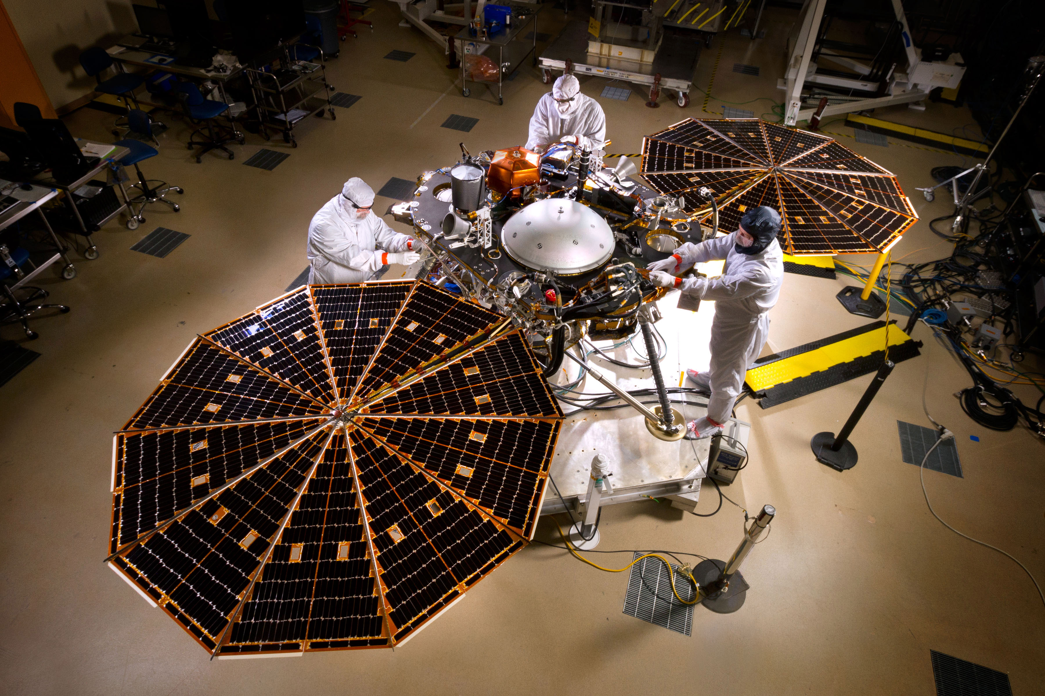 NASA's InSight Mars lander spacecraft in a Lockheed Martin clean room near Denver. As part of a series of deployment tests, the spacecraft was commanded to deploy its solar arrays in the clean room to test and verify the exact process that it will use on the surface of Mars.